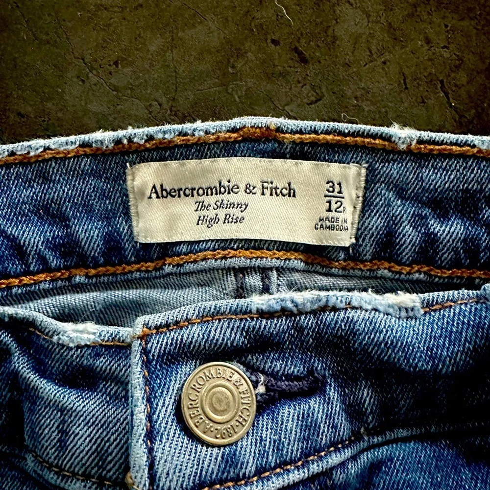 Abercrombie size 12/31 skinny high rise with distressed bottoms. - Picture 1 of 5